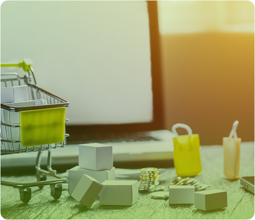 Boxes, bottles, and a barcode scanner on a desk with sunlight in the background