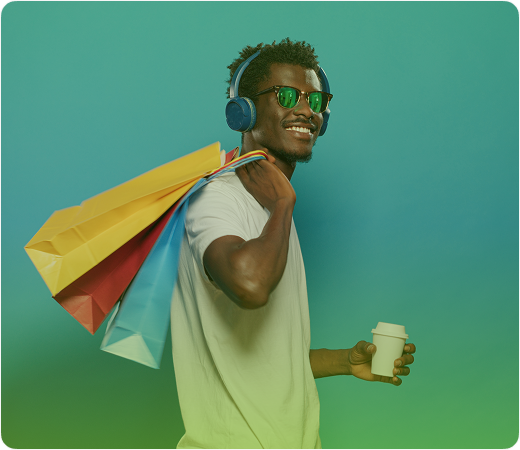 Happy shopper with bags and headphones