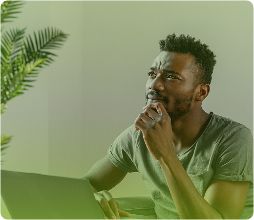 Freelancer thinking while holding a banknote